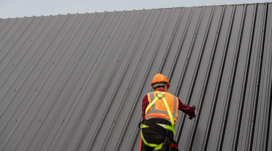 Professional metal roof installation services in Haileyville, OK